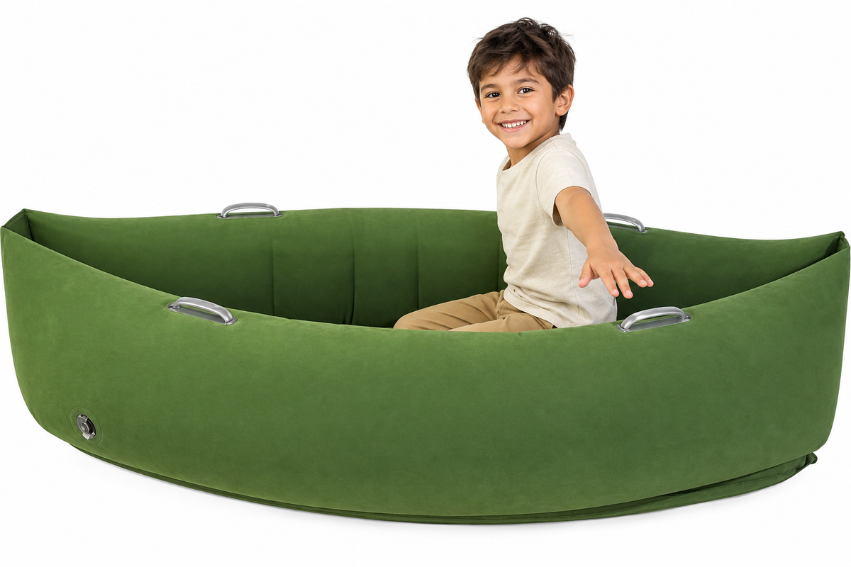 Child in beige shirt in green sensory peapod