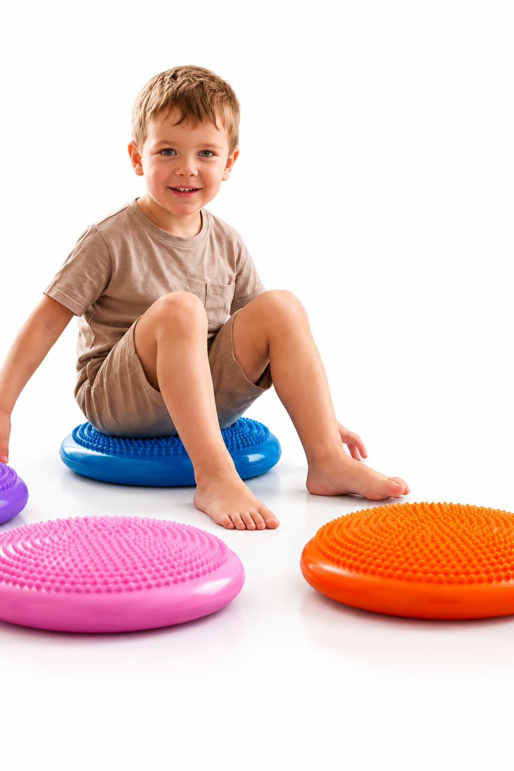 Child seated on sensory cushion with white background