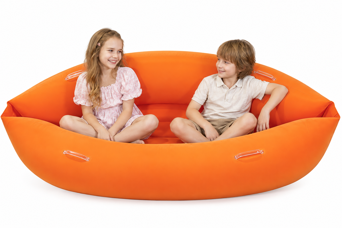 Children seated in relaxed positions inside the orange peapod
