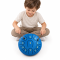 Four-year-old child playing the blue tongue drum