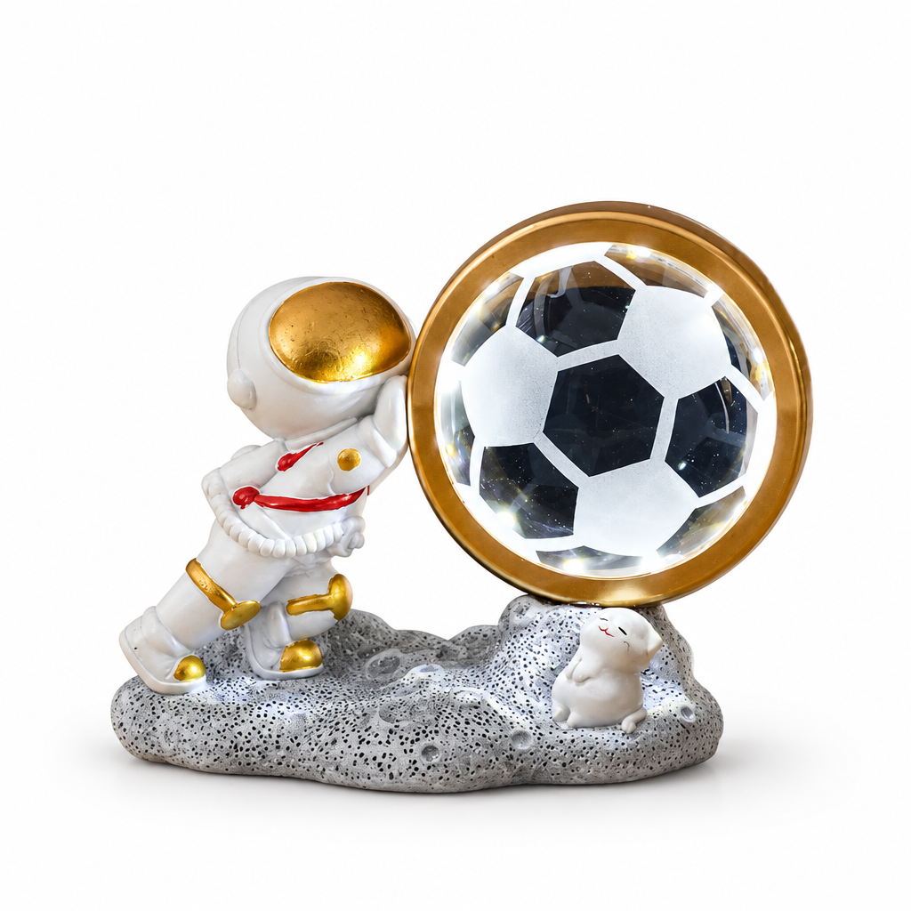 Globe and astronaut, soccer-ball design on white