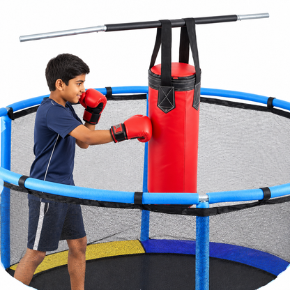 Indian boy using punching bag on white background
