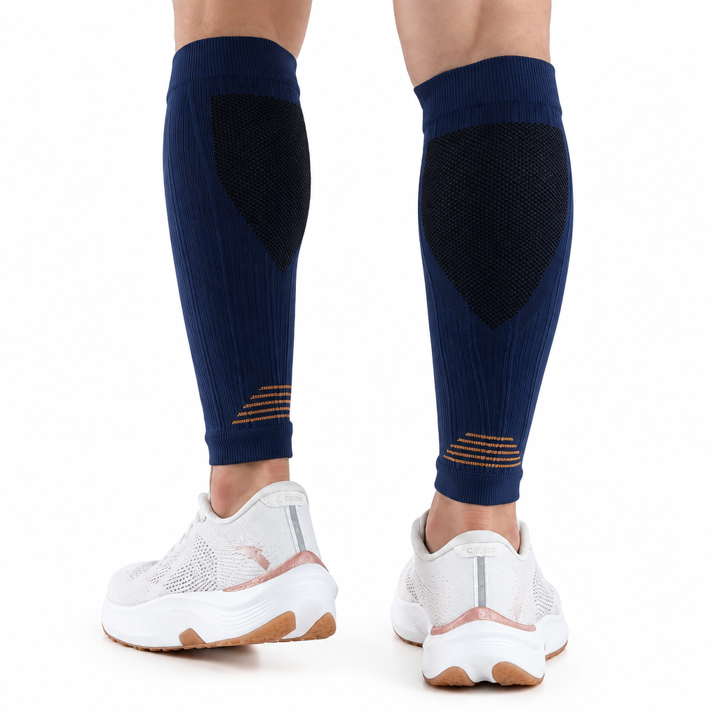 Navy calf sleeves on legs with packaging removed and a white background