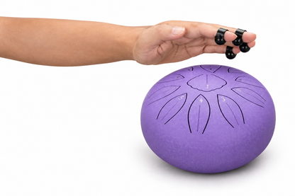 Purple drum played with finger picks on white