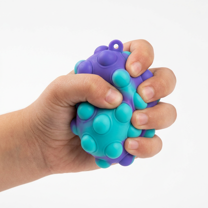 Purple turquoise ball, child hand squeezing