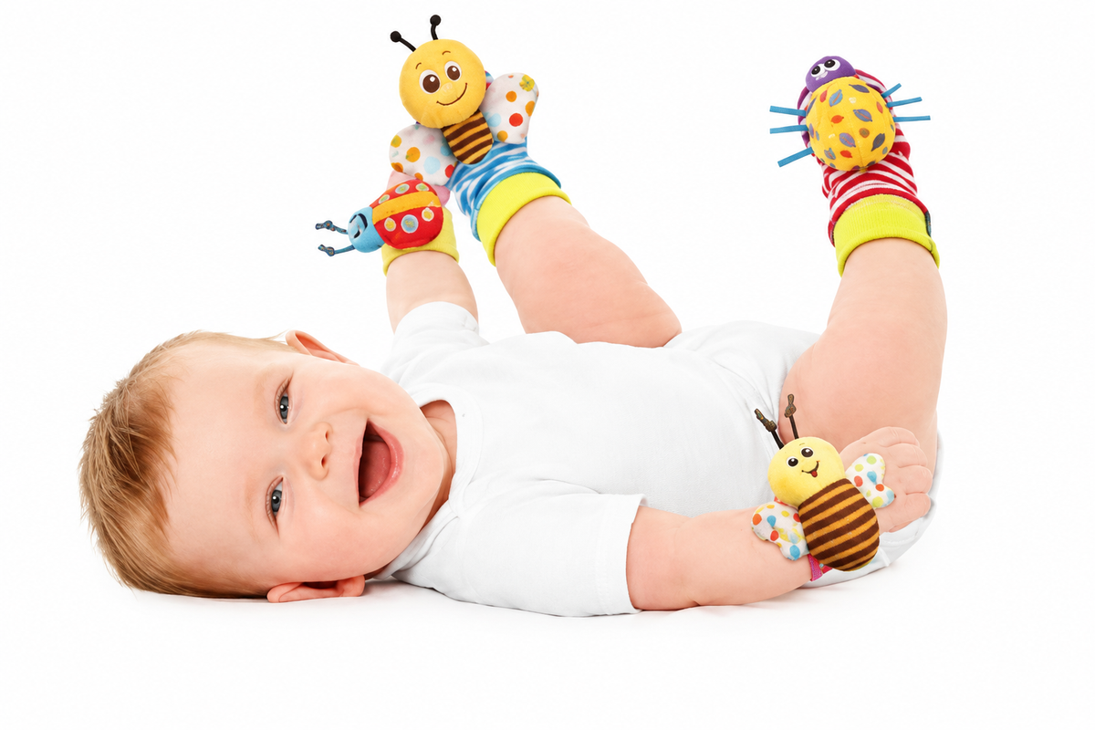 Same baby wearing the original wrist rattles and socks