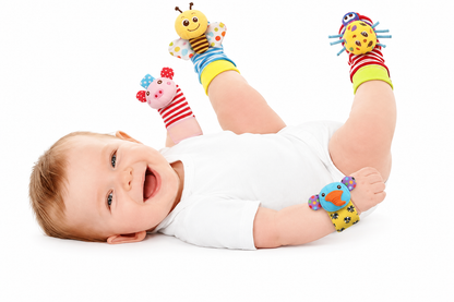 Same baby wearing the pink animal and blue bird wrist rattles