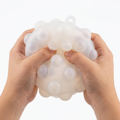 White ball, child hands squeezing